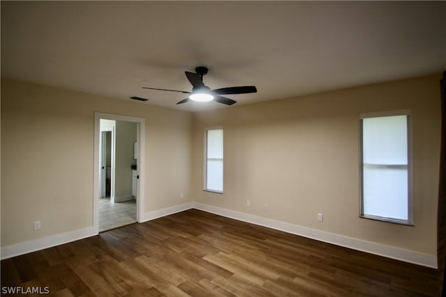 unfurnished room with ceiling fan and hardwood / wood-style floors