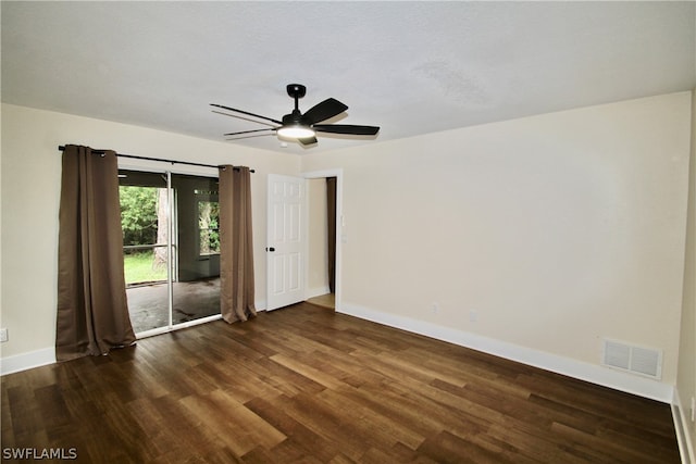 empty room with dark wood-type flooring and ceiling fan