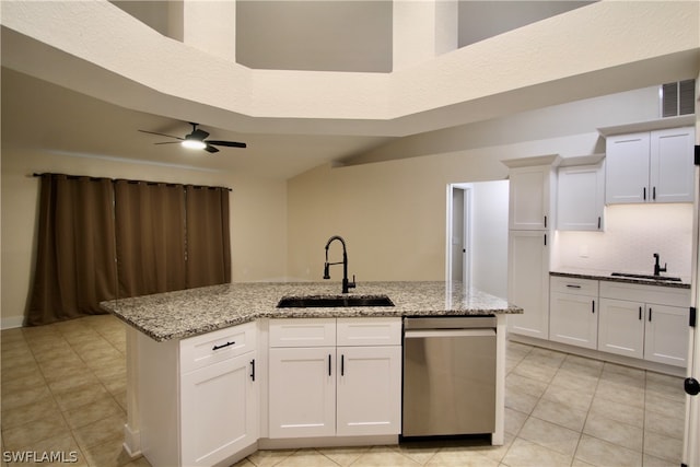 kitchen with ceiling fan, white cabinets, sink, dishwasher, and light tile patterned floors