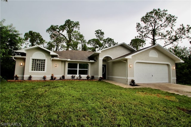 ranch-style home with a garage and a front yard