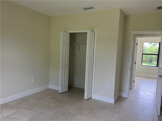 unfurnished bedroom featuring a closet