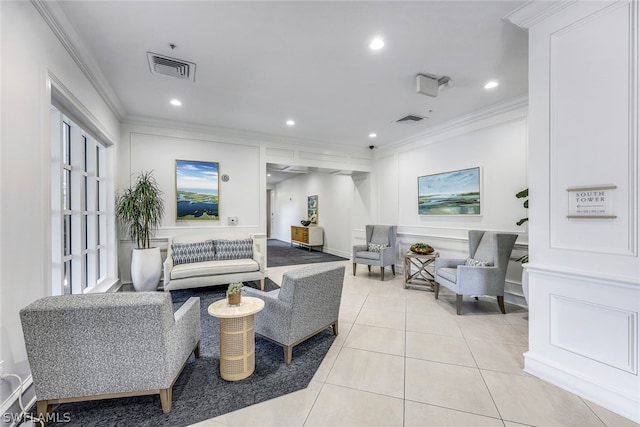 living room featuring ornamental molding and light tile patterned flooring