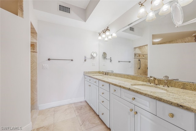 bathroom with a shower and vanity