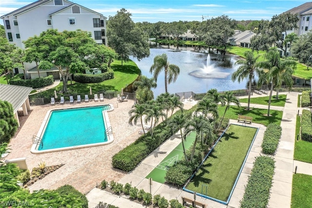 view of swimming pool featuring a water view