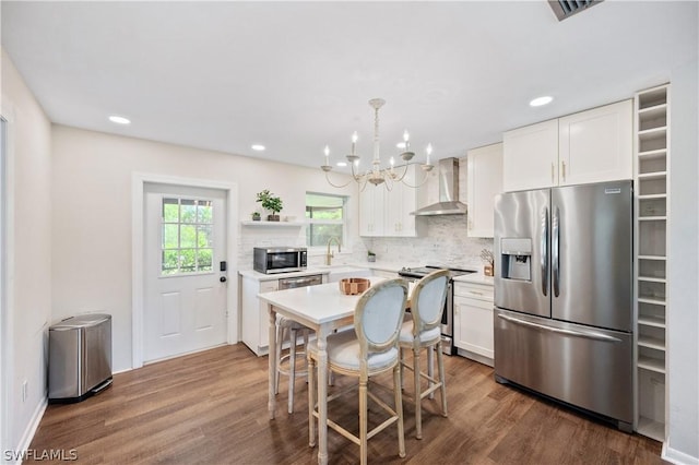 kitchen with open shelves, wall chimney exhaust hood, white cabinets, and stainless steel appliances