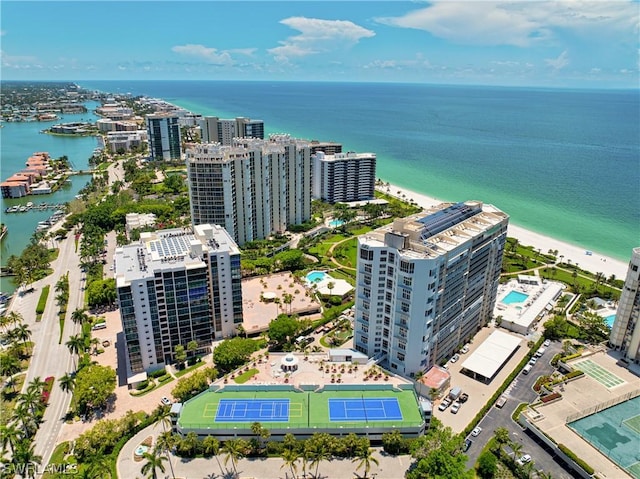 birds eye view of property featuring a water view and a city view