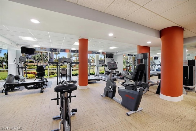 workout area featuring a paneled ceiling