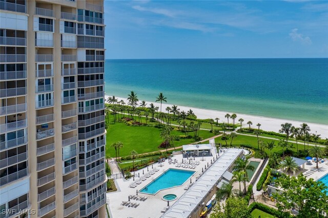 exterior space featuring a beach view and a water view