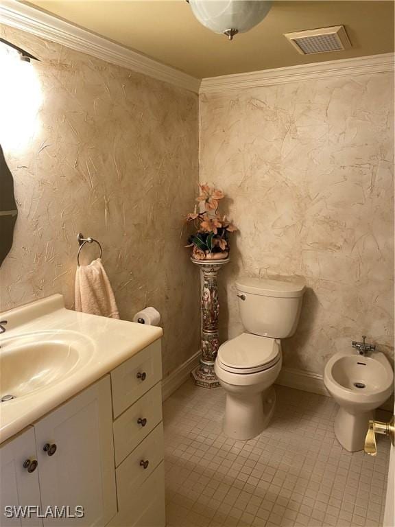 half bath with visible vents, toilet, ornamental molding, a bidet, and vanity