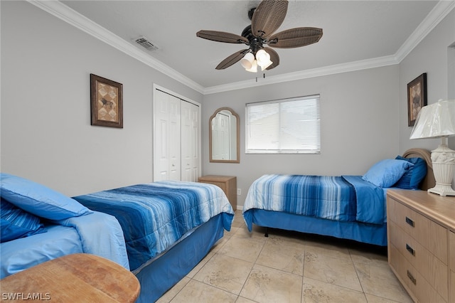 bedroom featuring ceiling fan, ornamental molding, light tile patterned floors, and a closet