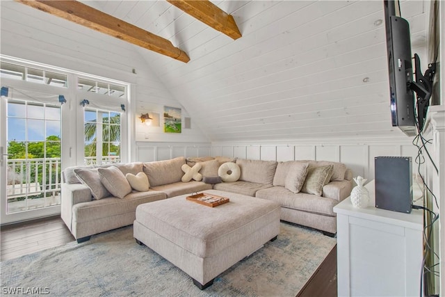 living room featuring lofted ceiling with beams, wood-type flooring, and wooden ceiling