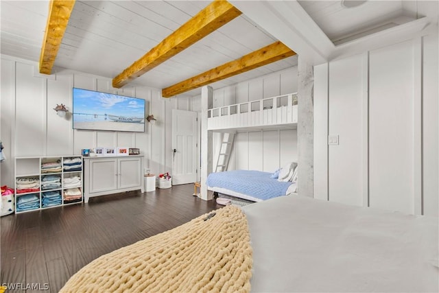 bedroom with dark hardwood / wood-style flooring and beam ceiling