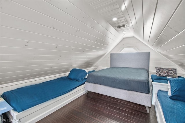 bedroom with lofted ceiling, wooden walls, wooden ceiling, and dark hardwood / wood-style floors