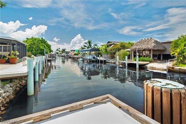 dock area with a water view and a gazebo