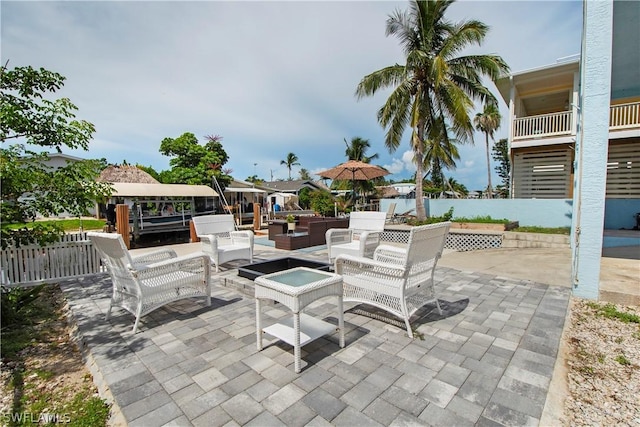 view of patio / terrace featuring a jacuzzi and an outdoor hangout area