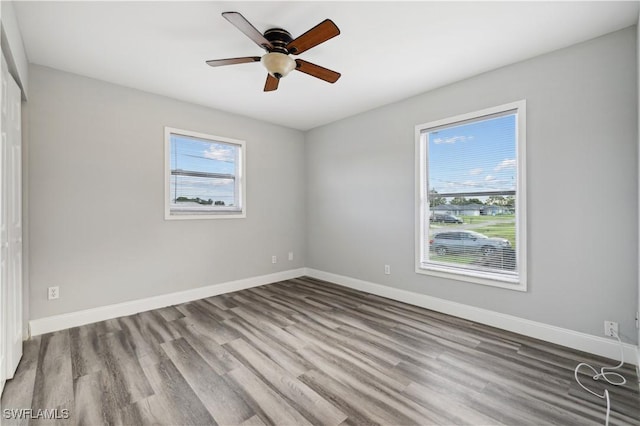 unfurnished room featuring ceiling fan and light wood-type flooring