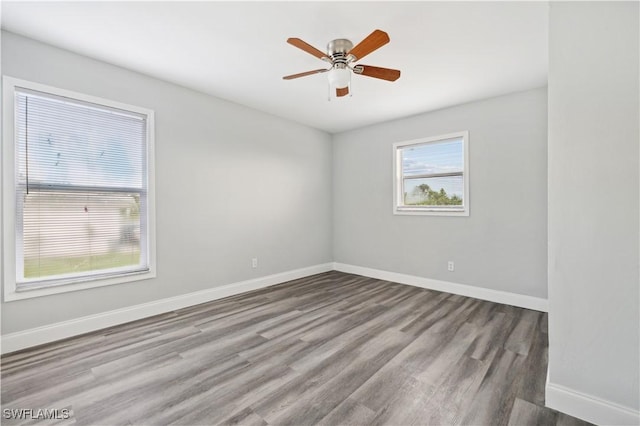 unfurnished room with hardwood / wood-style flooring and ceiling fan