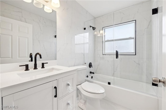 full bathroom with vanity, toilet, and bath / shower combo with glass door