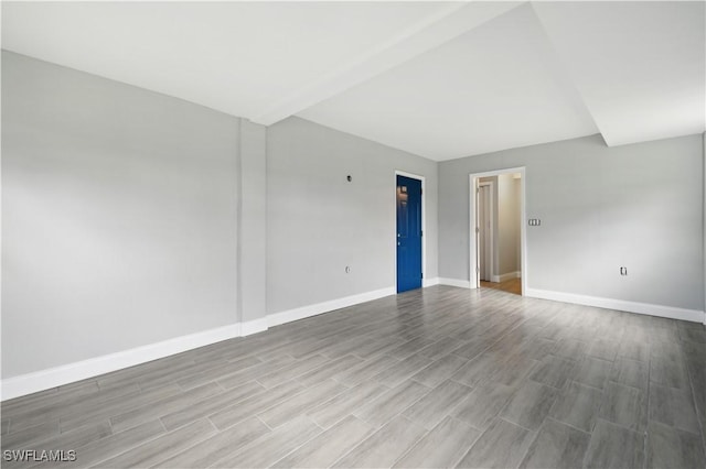 unfurnished room featuring hardwood / wood-style flooring