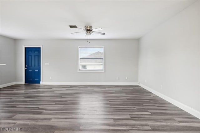 empty room with hardwood / wood-style flooring and ceiling fan