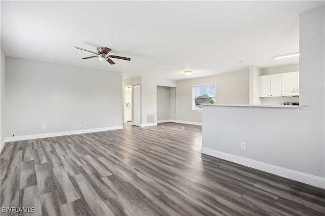 unfurnished living room featuring hardwood / wood-style flooring and ceiling fan