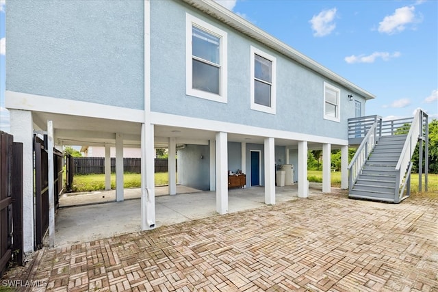 rear view of house featuring a patio