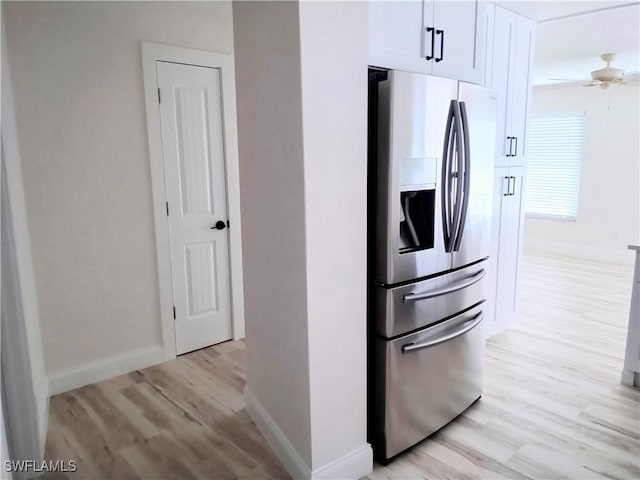 kitchen with white cabinets, ceiling fan, light wood-type flooring, and stainless steel refrigerator with ice dispenser