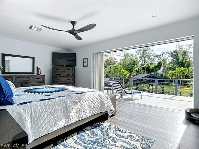 15711 Anderson Ln, Fort Myers, FL 33912 - bedroom with wood finished floors and ceiling fan