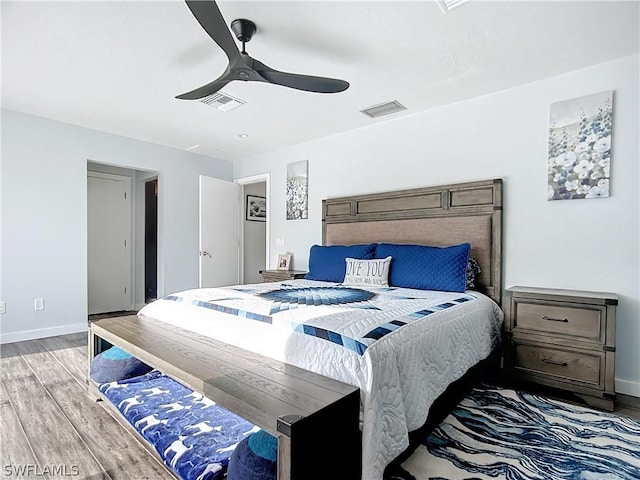 bedroom with light wood-type flooring and ceiling fan