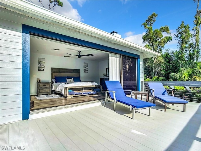 view of patio with a hot tub and a deck