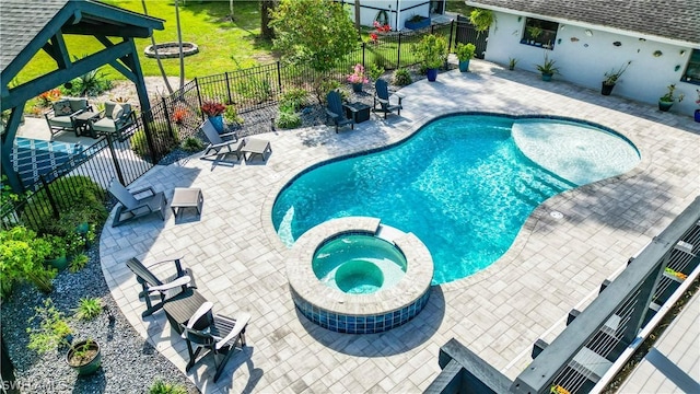 view of swimming pool with a patio area, a gazebo, and an in ground hot tub