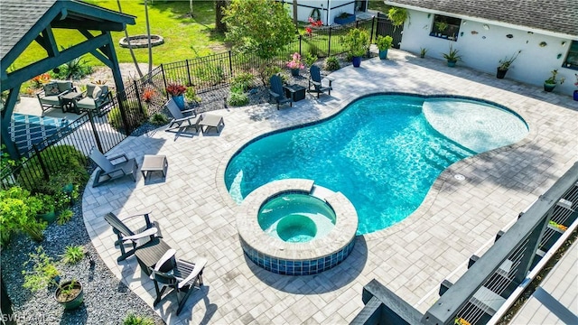 15711 Anderson Ln, Fort Myers, FL 33912 - view of pool with a pool with connected hot tub, a patio, and fence