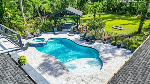 15711 Anderson Ln, Fort Myers, FL 33912 - view of swimming pool featuring an outdoor fire pit, a gazebo, a patio, and a pool with connected hot tub
