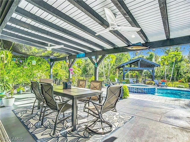 view of patio / terrace with ceiling fan, a swimming pool with hot tub, a gazebo, and a pergola