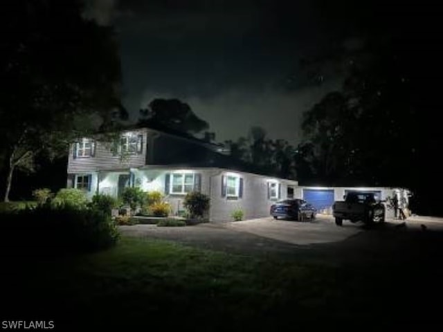 view of back house at night