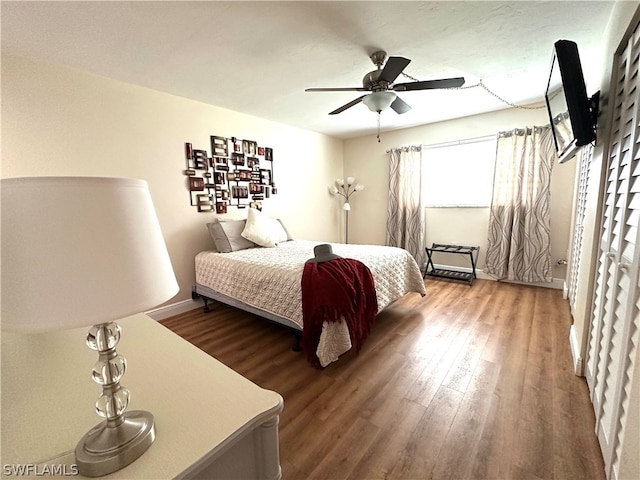 bedroom featuring ceiling fan and hardwood / wood-style floors