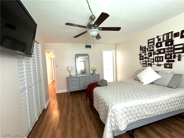 bedroom featuring dark wood-type flooring and ceiling fan