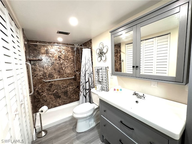 full bathroom with shower / bath combo, toilet, vanity, and hardwood / wood-style flooring