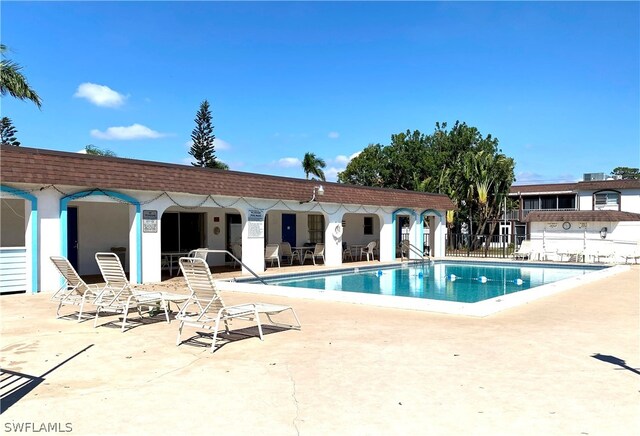 view of swimming pool with a patio