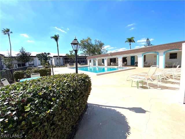 view of swimming pool featuring a patio area