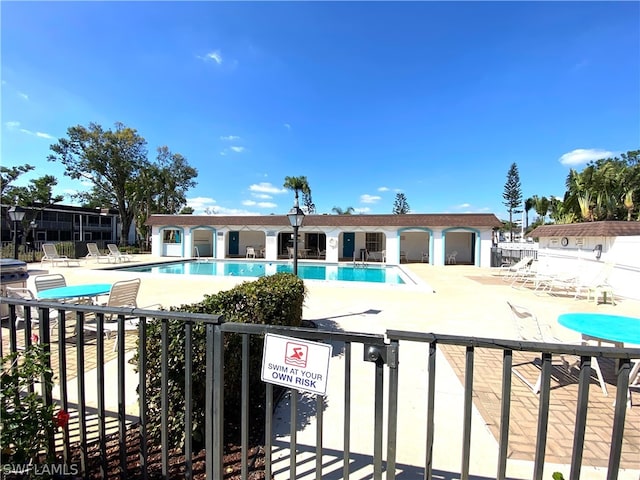 view of swimming pool featuring a patio