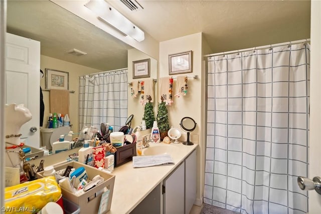 bathroom with vanity and a shower with curtain