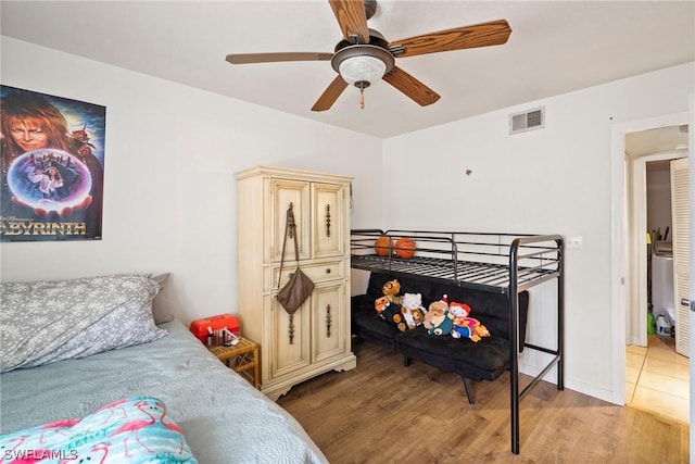 bedroom featuring light wood-type flooring and ceiling fan