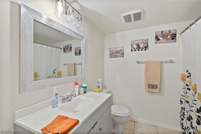 bathroom with vanity, toilet, curtained shower, and tile patterned flooring