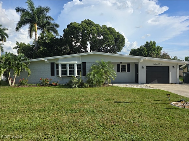 ranch-style house with a garage and a front yard