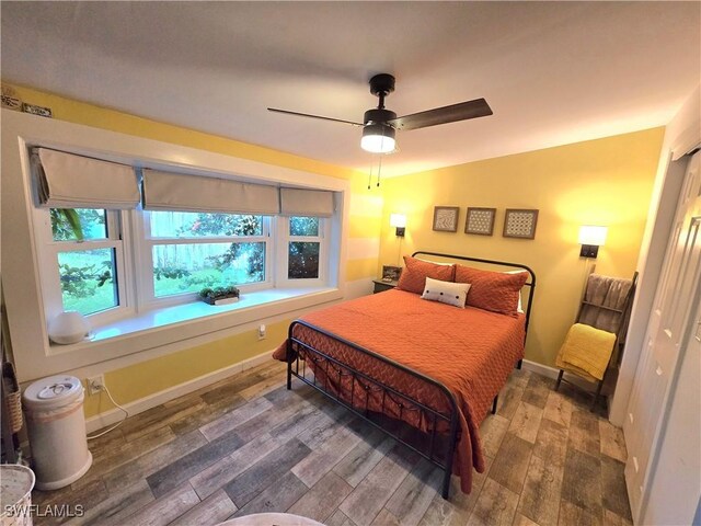 bedroom featuring wood-type flooring and ceiling fan