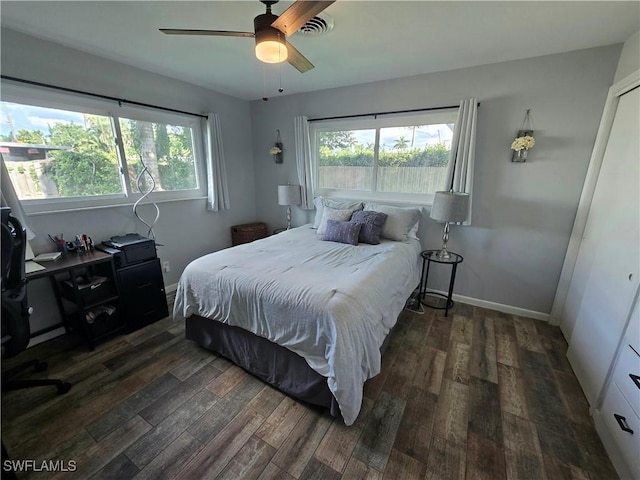 bedroom featuring ceiling fan and dark hardwood / wood-style floors