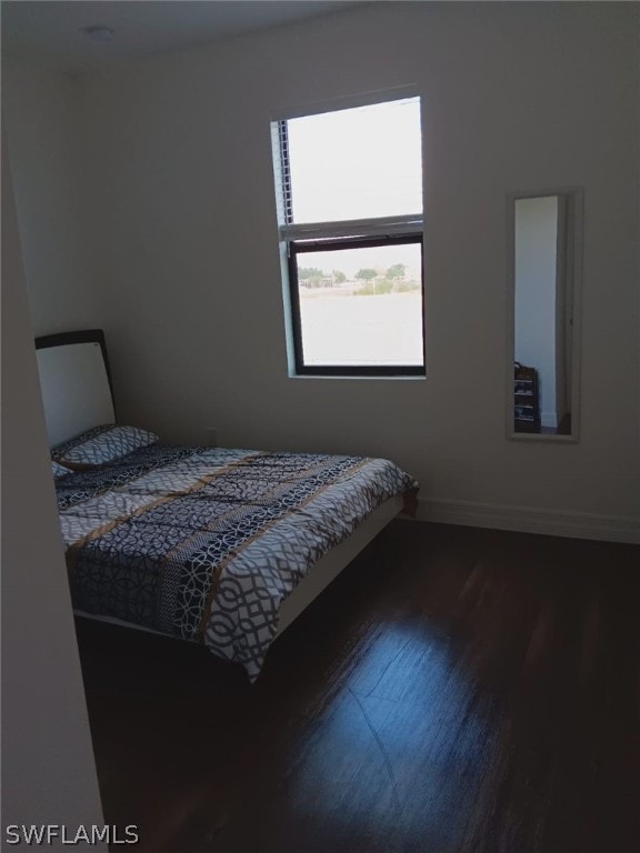 unfurnished bedroom featuring hardwood / wood-style flooring