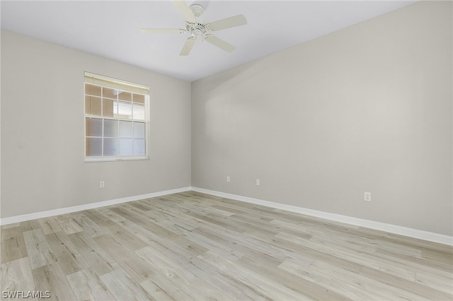 spare room with ceiling fan and light hardwood / wood-style flooring