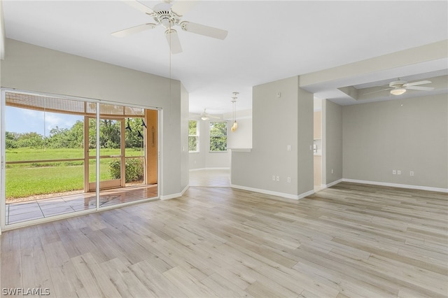 unfurnished living room with light wood-type flooring and ceiling fan